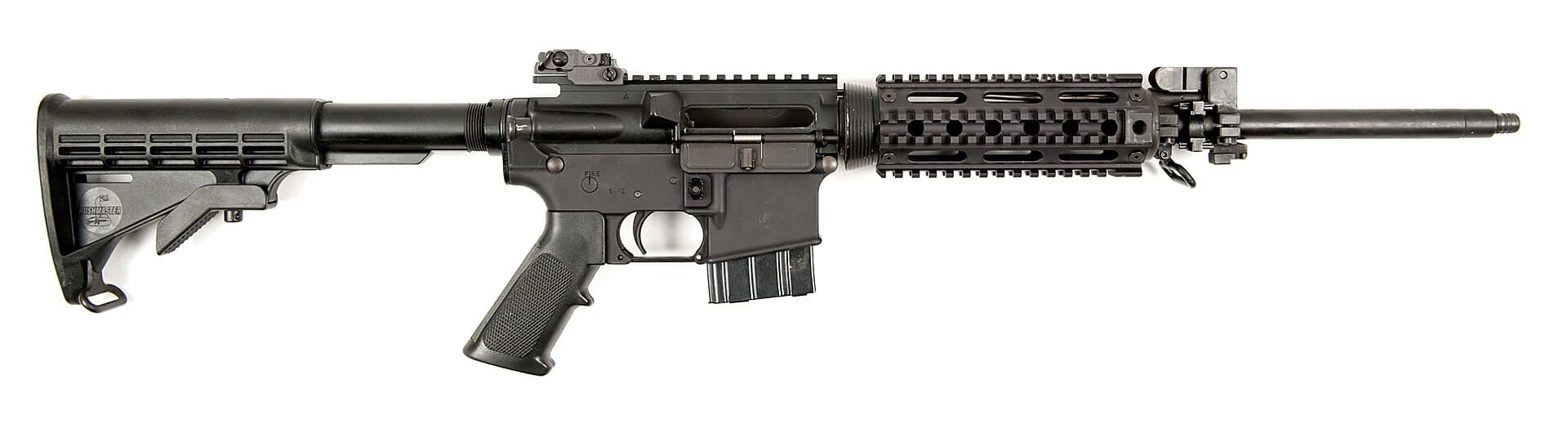 A black AR-15-style semiautomatic rifle photographed in profile on a white background